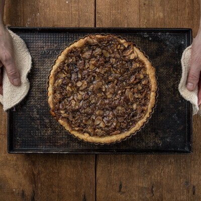 Cooked tart coming out of oven